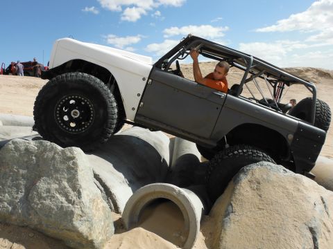1979 Ford Bronco - A heavily modified 1979 Ford Bronco navigates a challenging off-road obstacle course.