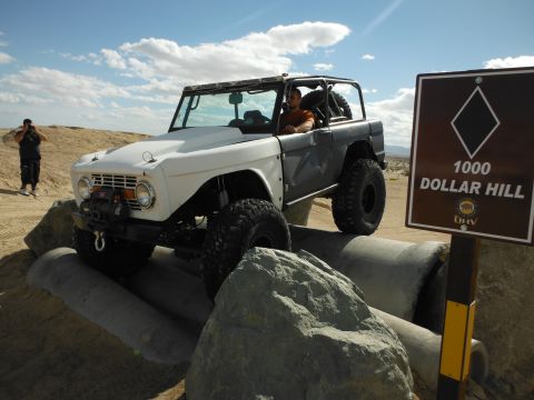 1979 Ford Bronco - This 1979 Ford Bronco is tackling a challenging off-road course with concrete pipes and rocks.
