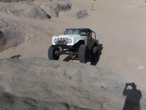 1979 Ford Bronco - A modified 1978 Ford Bronco navigates a rocky desert terrain.