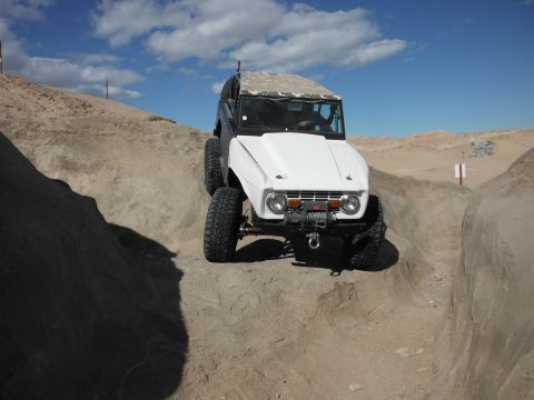 1979 Ford Bronco - A modified 1979 Ford Bronco navigates a challenging off-road trail.