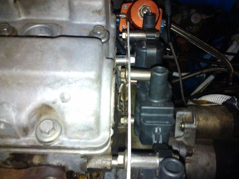 1995 Ford Probe - Close-up view of engine components, including ignition coils and an orange part.