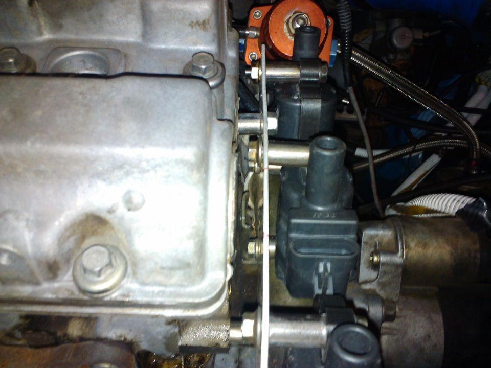 Engine block with ignition coils and orange component