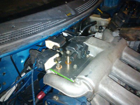 1995 Ford Probe - Engine bay components, including ignition coils and intake manifold, are shown in this close-up view.