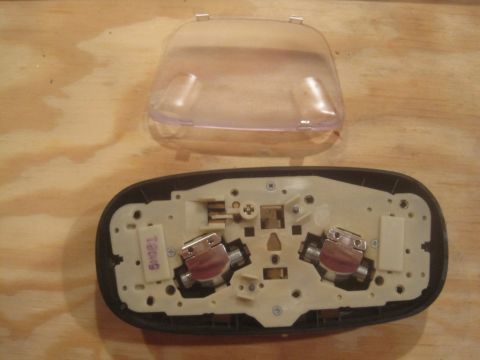 1993 Ford Bronco - Overhead dome light assembly with clear lens removed, showing bulb sockets and wiring.