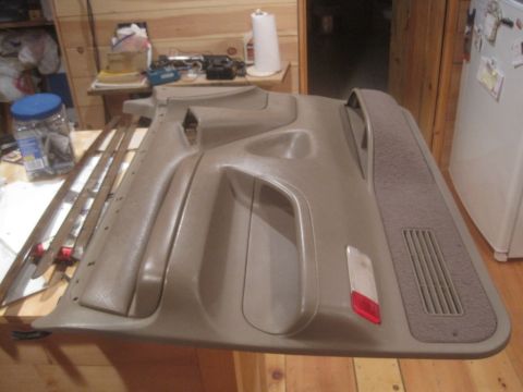 1993 Ford Bronco - Interior door panel, likely from a Ford Bronco, shown disassembled.