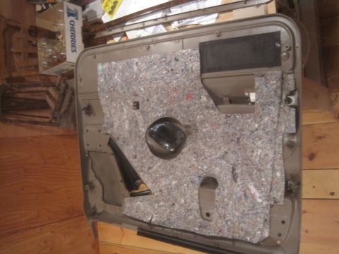 1993 Ford Bronco - This is a car door panel, not a complete vehicle, and its year cannot be determined from the image.