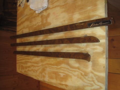 1993 Ford Bronco - Set of three Eddie Bauer interior trim pieces with a wood grain finish are displayed.