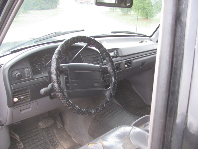 Interior view of a 1992 Ford F-Series truck dashboard and steering wheel