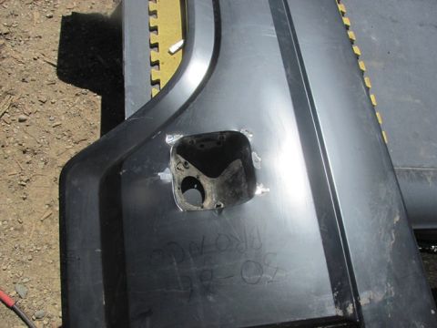 1996 Ford Bronco - A car door panel, possibly from a Ford Bronco, is shown with visible repairs and handwritten markings.
