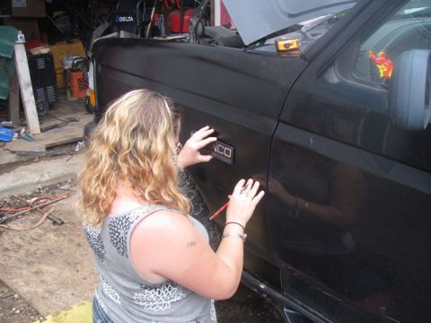 1996 Ford Bronco - Attaching a 'BRONCO' emblem to the fender of a 1996 Ford Bronco.