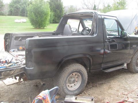 1996 Ford Bronco - This black Ford Bronco appears to be a third-generation model, likely from the late 1980s, with its top removed for work.