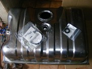1996 Ford Bronco - A metal fuel tank and its associated parts are shown from a top-down perspective.