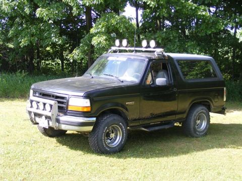 1996 Ford Bronco - This black 1996 Ford Bronco features a bull bar and auxiliary lights mounted on the roof rack.