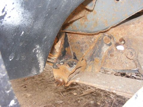 1996 Ford Bronco - Close-up view of heavily rusted suspension components, indicating extensive wear and tear.