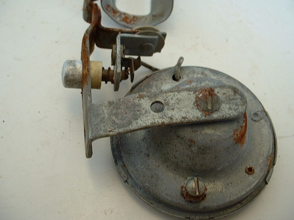 rusted car horn assembly with mounting bracket and adjustment screw