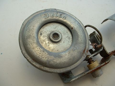 1994 Ford Bronco - A close-up view of a Delta horn, showing its metallic construction and visible branding.