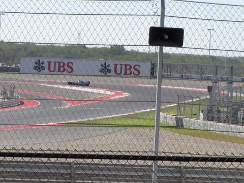 2006 BMW 5 Series - A lone race car navigates a turn on a sunny day at the Circuit of the Americas.