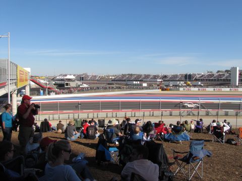 2006 BMW 5 Series - A race track event with spectators gathered to watch the competition.