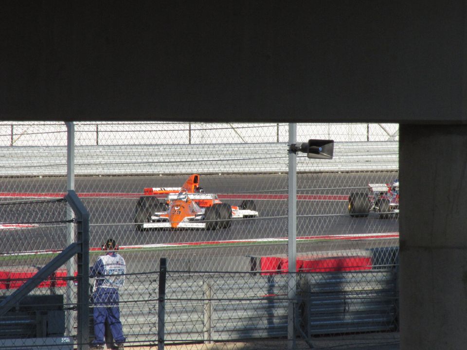 Orange and white race car on track, number 29 visible