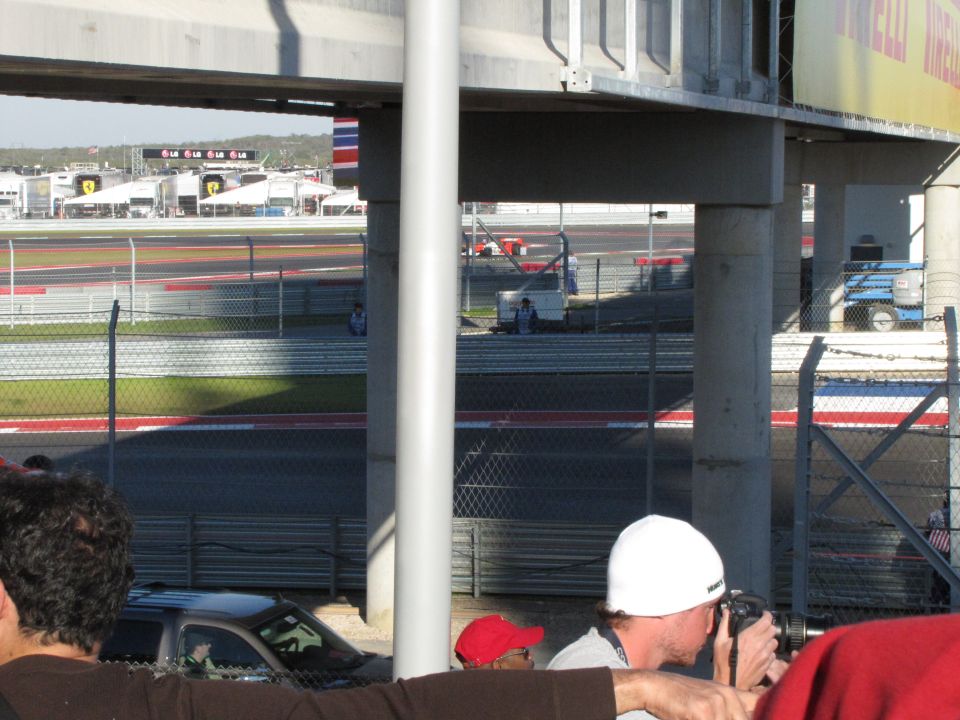Race track with grandstands, fences, and a blue lift