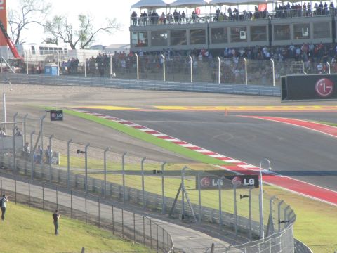 2006 BMW 5 Series - A view of the Circuit of the Americas race track, grandstands and sponsor signage.
