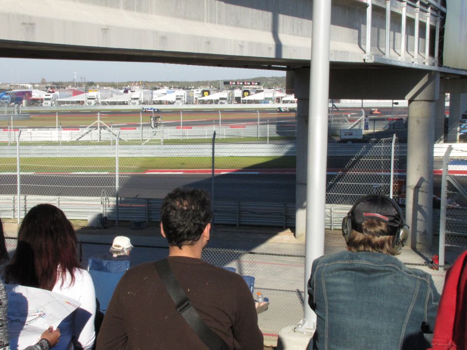 View of a race track with spectators in the foreground
