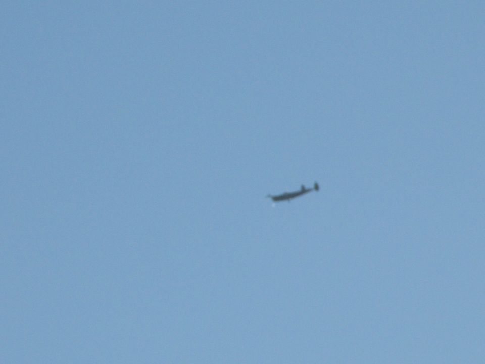 Airplane in flight against a clear blue sky