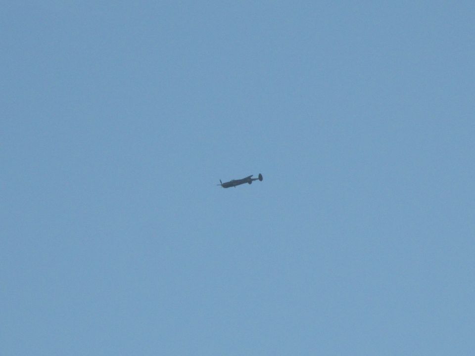 Airplane in flight against a clear blue sky