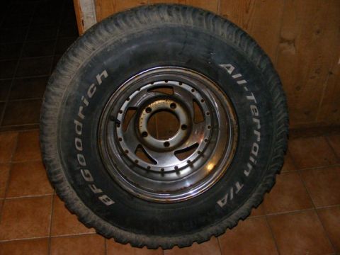 1996 Ford Bronco - A BFGoodrich All-Terrain T/A tire mounted on a chrome rim is shown.