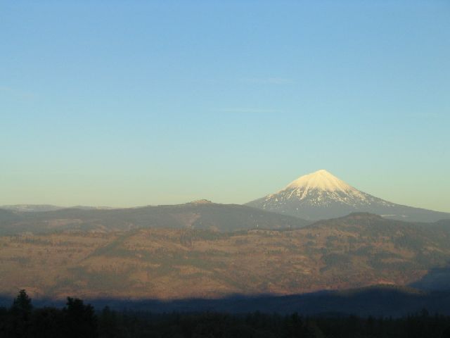 Snow-capped mountain peak under a clear blue sky