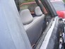 1996 Ford Bronco - The interior of a vehicle shows gray cloth seats and a partial view of the exterior.