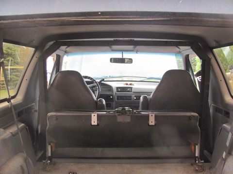 1996 Ford Bronco - The interior of this Ford Bronco shows a dashboard and seats consistent with a 1992 model year.