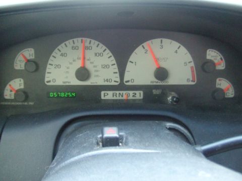 1990 Ford Bronco - The dashboard displays the speedometer reading 70 MPH and the tachometer at 2000 RPM, with an odometer reading 057825.4.