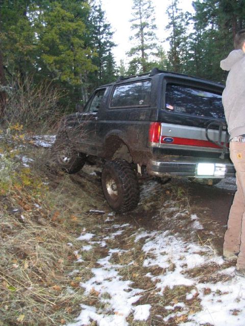 1988 Ford Bronco - Ford Bronco navigating a snowy, wooded trail.