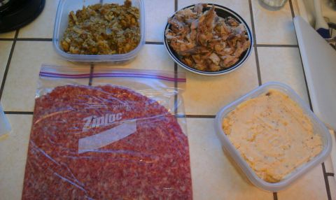 1989 Ford Bronco - Food items prepared for a meal, including sliced salami and other dishes.