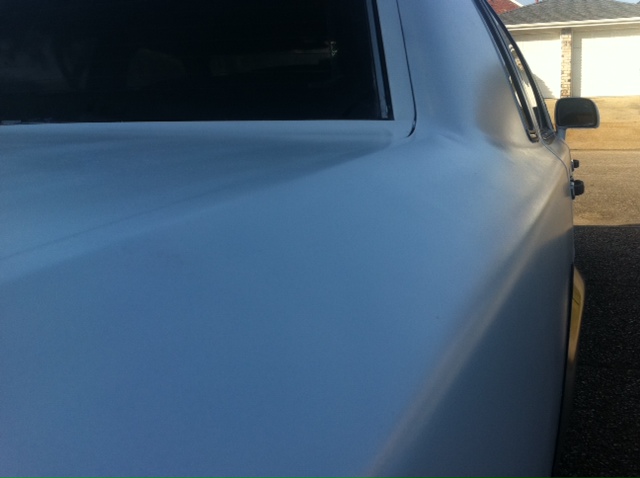 Light blue car rear quarter panel and window trim