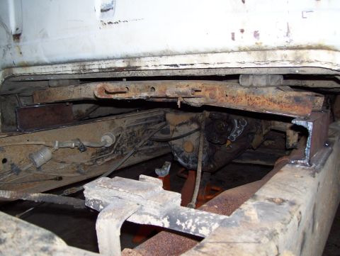 1972 Ford F-150 - The underside of a white truck shows its frame and drivetrain components, with a watermark at the bottom right.