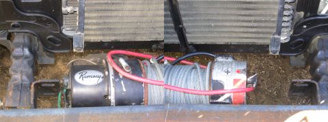 1983 Ford Bronco - With the winch drum centered between the frame rails, there's barely a half inch between the motor & the R frame tab (where the green wires…