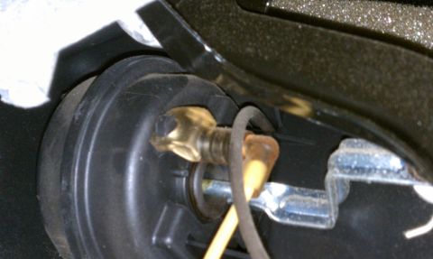 2000 GMC Jimmy - A close-up view of a vehicle's internal component, showing wiring and mounting hardware.