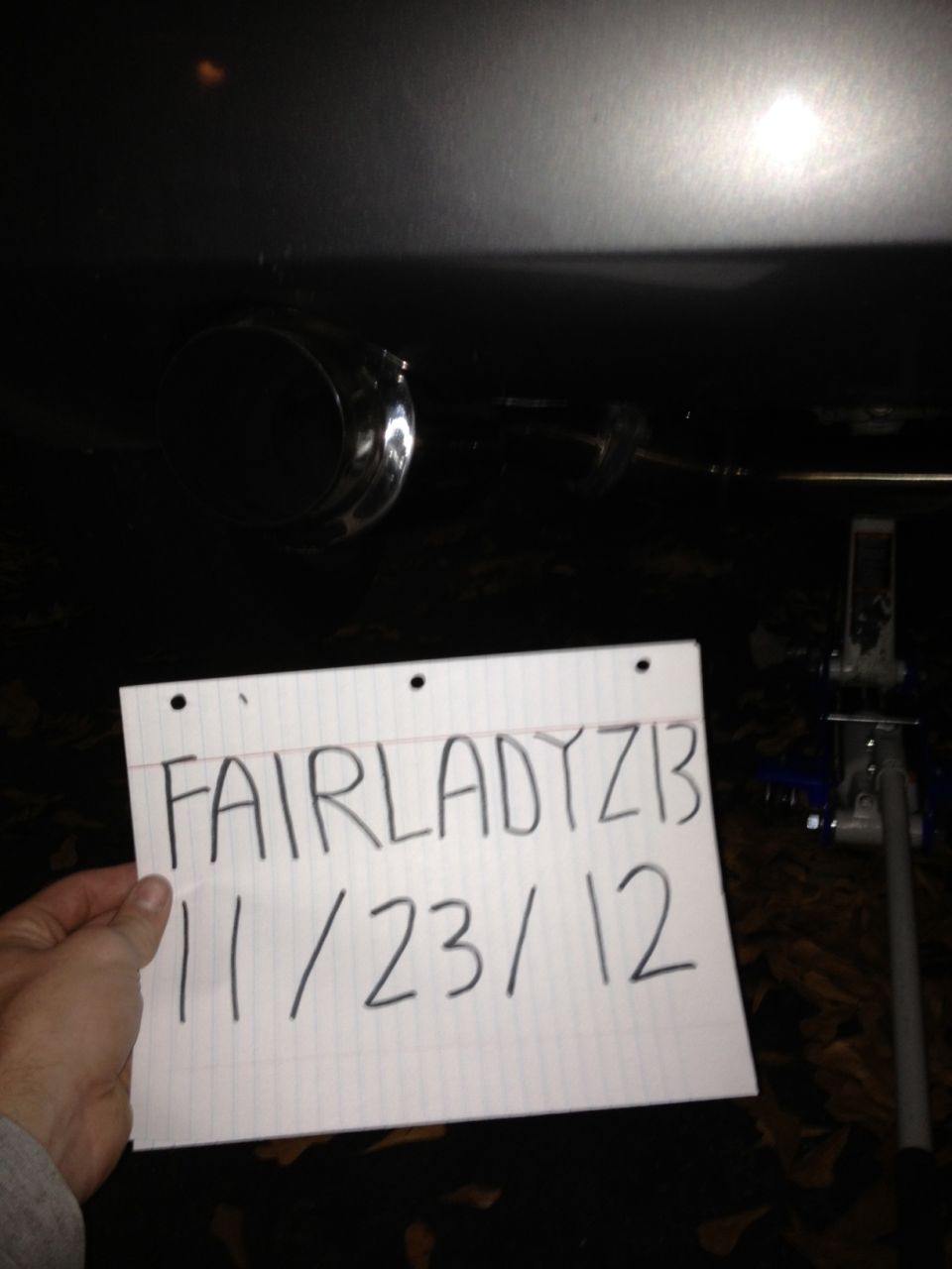 Exhaust pipe with paper reading FAIRLADYZ1B 11/23/12