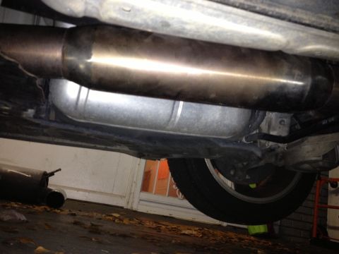 1996 Ford Bronco - View of the underbody exhaust system and a tire, with a "SUPERMOTORS.NET" watermark visible.