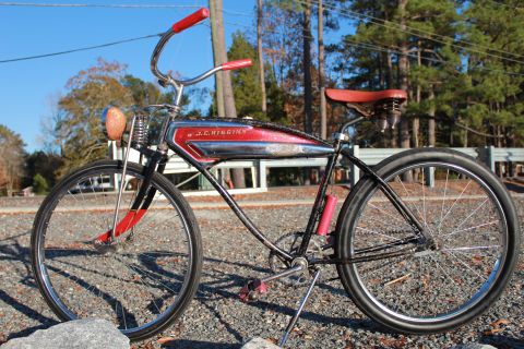 1994 Ford Bronco - A vintage J.C. Higgins bicycle with a distinctive red and chrome tank is shown outdoors.