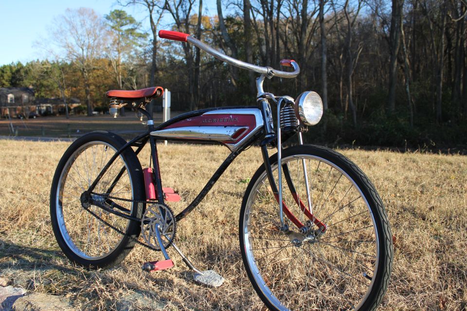 Bicycle with red handlebars, chrome and red gas tank, and a headlight