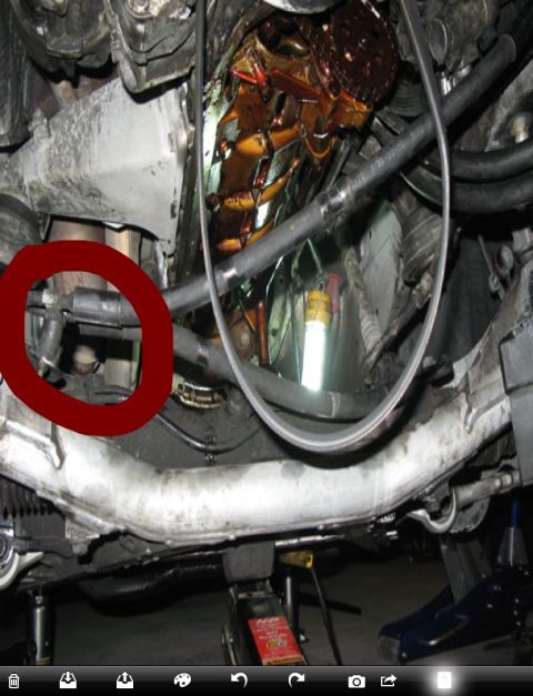 1999 BMW 5 Series - Close-up view of a vehicle's engine bay, with a red circle drawn around a specific part.