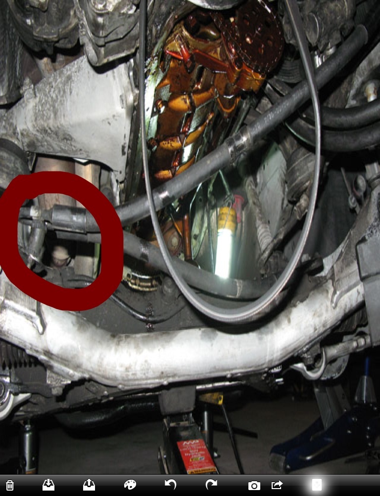 Engine bay with red circle highlighting a component