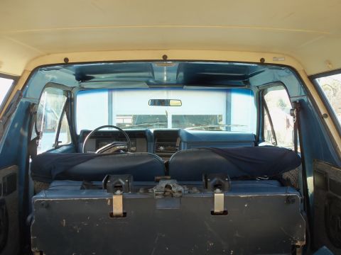 1985 Ford Bronco - Interior view of a blue SUV, likely from the 1980s, with a Supermotors.net watermark.