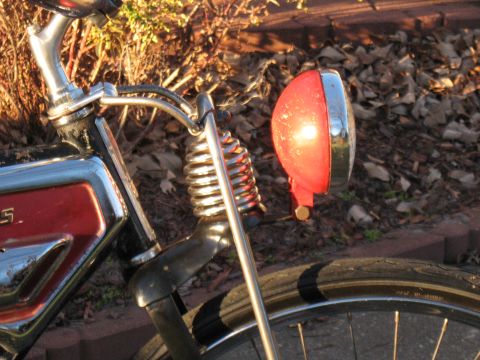 1994 Ford Bronco - A vintage motorcycle's front end is captured in a close-up shot, highlighting its classic design elements.