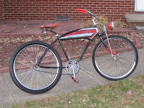1994 Ford Bronco - This vintage bicycle features a distinctive red and chrome tank with red handlebars and pedals.