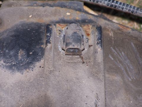 1990 Ford Bronco - Differential housing with a sensor, likely from a vehicle's drivetrain system.