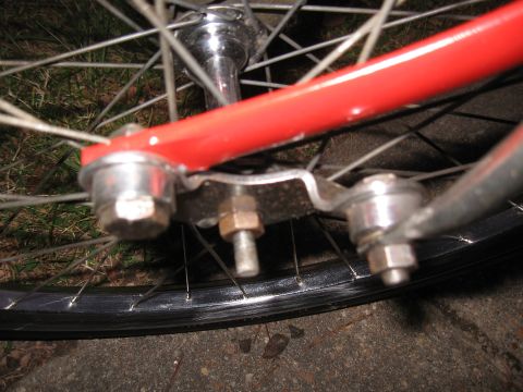 1994 Ford Bronco - Detail of a bicycle's front fork and wheel assembly, showing the mounting hardware.